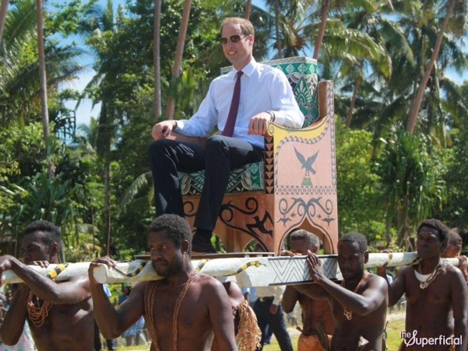 Prince William being carried in a chair. Monarchy is incompatible with democracy. 